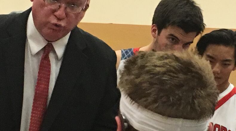 First-year Talawanda coach Tim Reed makes a point during a timeout Dec. 1, 2017, in Oxford. The Braves lost to Fenwick 64-40 in season-opening play. RICK CASSANO/STAFF