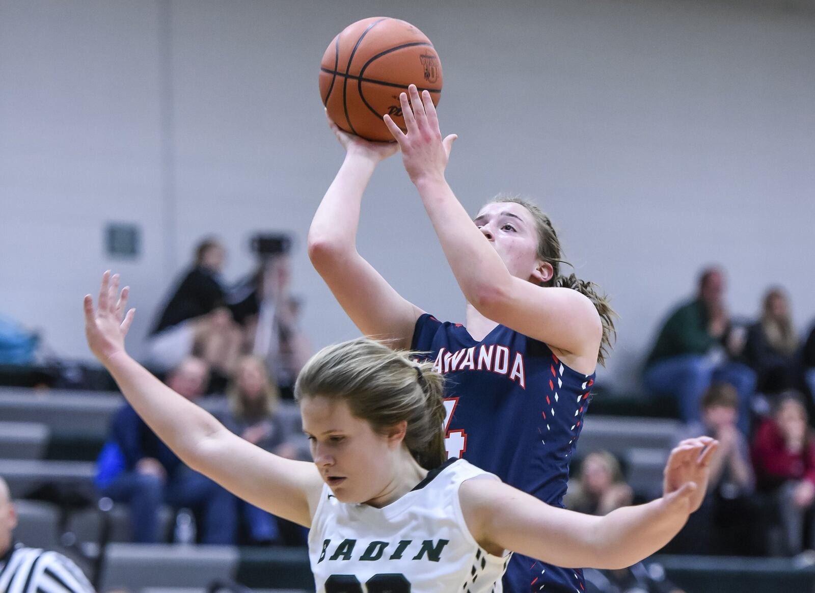 Talawanda’s Emma Wright puts up a shot over Badin’s Lauren Krause during their game Monday night at Mulcahey Gym in Hamilton. NICK GRAHAM/STAFF
