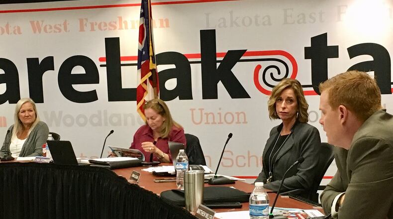 Lakota Schools Treasurer Jenni Logan, second from right, presented the state-mandated, five-year financial forecast to the school board Monday evening and reported a $3.7 million budget deficit is possible in 2023. The board, however, voted to approve the forecast though board member Lynda O’Connor voted against it, citing a need to address the $3.7 million quickly and asking fellow board members to agree to a commitment for that action.