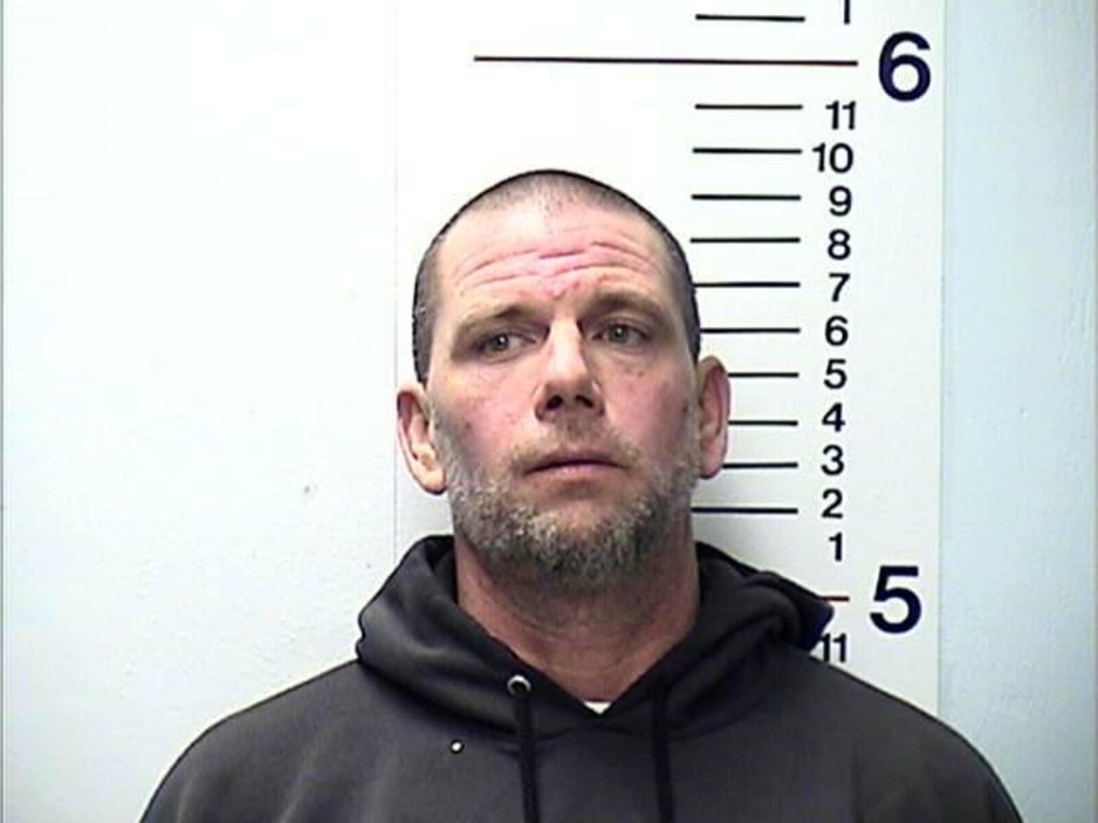 James A. Gentry, 44, of Middletown, was charged with having weapons under disability, receiving stolen property and discharging a firearm within city limits, according to police.