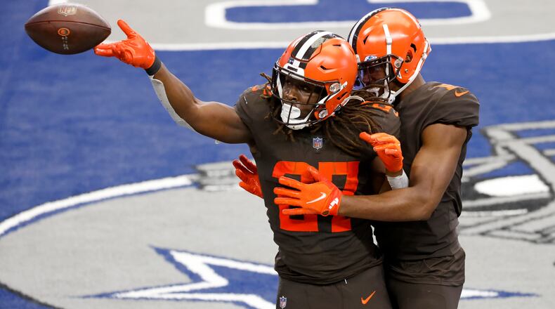 Cleveland Browns running back Kareem Hunt (27) and wide receiver Donovan Peoples-Jones, right, celebrate a touchdown scored by Hunt in the second half of an NFL football game against the Dallas Cowboys in Arlington, Texas, Sunday, Oct. 4, 2020. (AP Photo/Ron Jenkins)