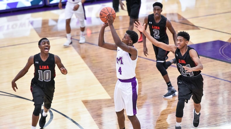 Middletown’s Aaron Jones puts up a shot during the first boys varsity game in the new Wade E. Miller Arena at Middletown High School on Dec. 9, 2017. Lima Senior won 75-32. NICK GRAHAM/STAFF
