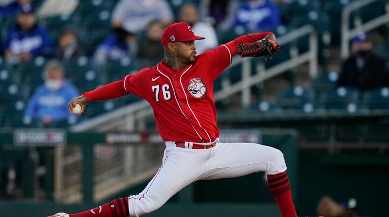 Cincinnati Reds starting pitcher Vladimir Gutierrez throws a pitch against the Los Angeles Dodgers during the first inning a spring training baseball game Tuesday, March 9, 2021, in Goodyear, Ariz. (AP Photo/Ross D. Franklin)