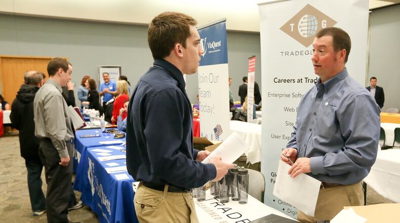 Tyler Meier of Oxford, talks with Tom Dalessandro of TradeGlobal during the Miami University Regional Butler County Job Fair, Wednesday, April 6, 2016. GREG LYNCH / STAFF