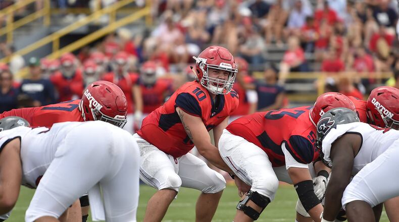 Dayton quarterback Jack Cook during last year’s game against Robert Morris at Welcome Stadium in Dayton. Erik Schelkun/CONTRIBUTED