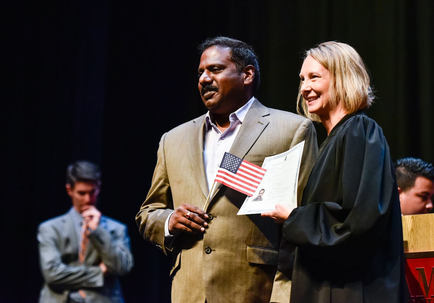 Nearly 100 people become U.S. citizens at naturalization ceremony at Miami Hamilton