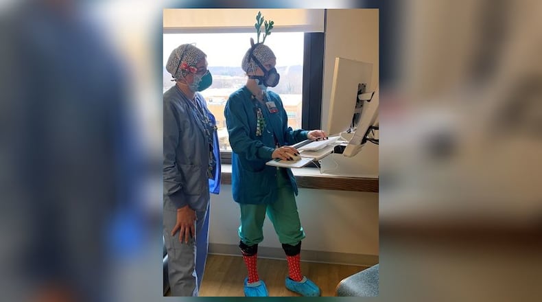 Anna Kuykendoll (right) is a registered nurse who cares for COVID-19 patients at Fort Hamilton Hospital. CONTRIBUTED