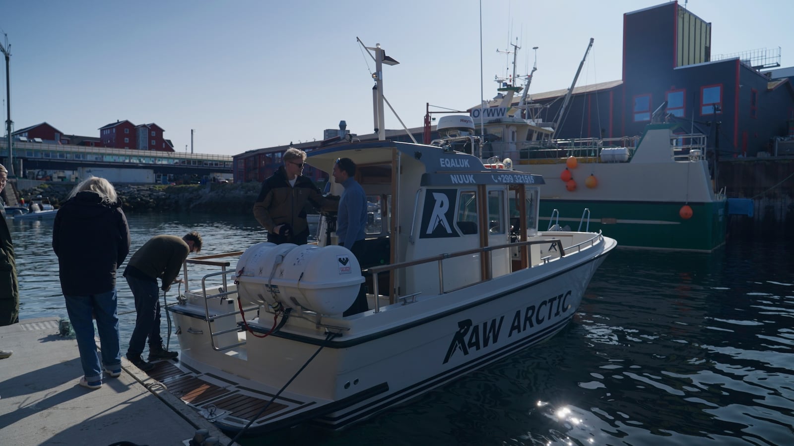 Passengers and tour guide on a tour boat of Raw Arctic at a harbour in Nuuk, Greenland, Wednesday, June 18, 2025. (AP Photo/Kwiyeon Ha)
