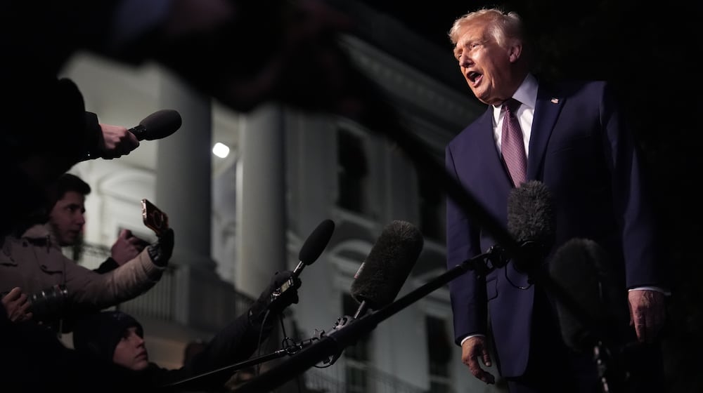 FILE - President Donald Trump talks to the media as he walks to Marine One from the White House, Friday, Dec. 19, 2025, in Washington. (AP Photo/Julia Demaree Nikhinson, File)