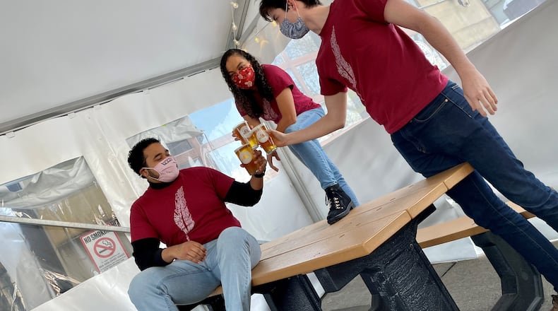 Angelique Archer, actor and tour manager at Cincinnati Shakespeare Company, is pictured with fellow actors at Hamilton’s Municipal Brew Works. CONTRIBUTED