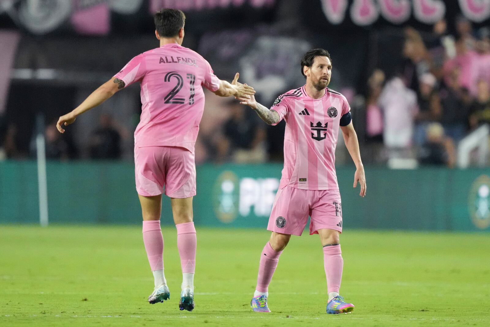 Inter Miami forward Lionel Messi (10) celebrates a goal with forward Tadeo Allende (21) against the Los Angeles FCduring the first half of a CONCACAF Nations League Quarterfinal Match at Chase Stadium, Wednesday, April 9, 2025 in Fort Lauderdale, Fla. (AP Photo/Jim Rassol)