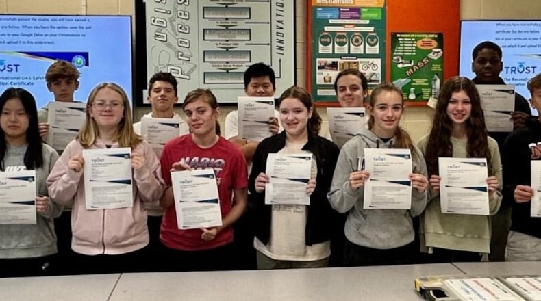 Junior high students at a Lakota school are learning first-hand the sky is the limit thanks to their exploration of aerial drones courtesy of a partnership with Butler Tech. And for the first time this, 7th and 8th grade students at Liberty Junior School have earned certification giving them legal authority to fly recreational drones within America’s airspace. Students show off their recently earned certifications. (Provided)