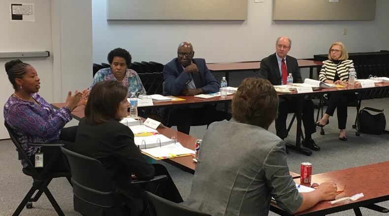 Preschool Promise Board member Anissa Lumpkin (left) addresses the rest of the board during the Wednesday, May 17, 2017 meeting. Around the table, from top right, are, Jane McGee Rafal, board attorney Chas Kidwell, Clay Dixon, Tasha Maye, Lumpkin, Debbie Feldman and Michelle Riley. JEREMY P. KELLEY / STAFF