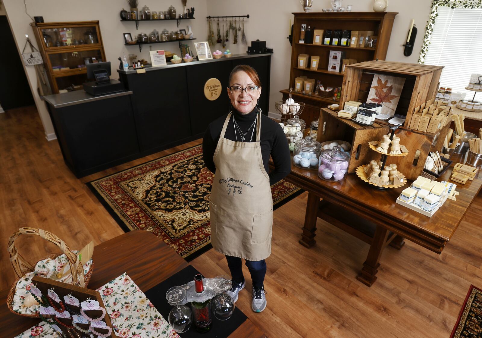 Sally Hathaway has opened Of the Witches Cauldron Apothecary on Winton Road in Fairfield. Hathaway makes natural cented candles, soaps and bath salts and has many other locally sourced items from other people. NICK GRAHAM / STAFF