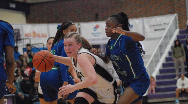 Lakota East's Emma Fohl drives past Winton Woods defenders on Tuesday night. Chris Vogt/CONTRIBUTED