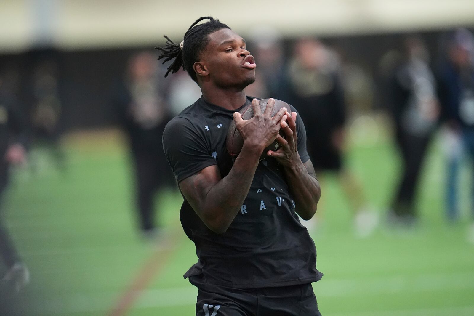 Colorado wide receiver Travis Hunter takes part in passing drills during the team's NFL football pro day Friday, April 4, 2025, in Boulder, Colo. (AP Photo/David Zalubowski)