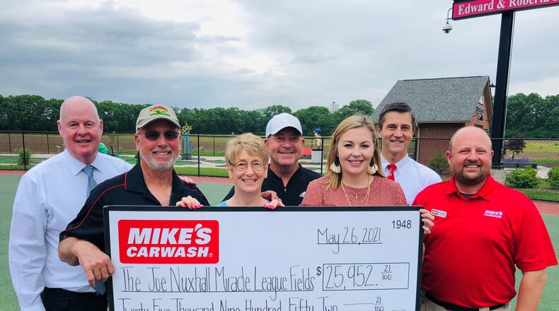 Mike's Car Wash donated nearly $26,000 to the Joe Nuxhall Miracle League Fields. Pictured from left, back row, are Mike's Car Wash CEO Mike Dahm, JNMLF board member Ron Riedy, and Mike's Car Wash COO Ty Dubay, and from left front, Miracle League volunteer CEO Kim Nuxhall, JNMLF Secretary Bonnie Nuxhall, Mike's Car Wash Assistant Marketing Manager Shannon Sellers and Mike's Car Wash Area Director Charles Abell. PROVIDED