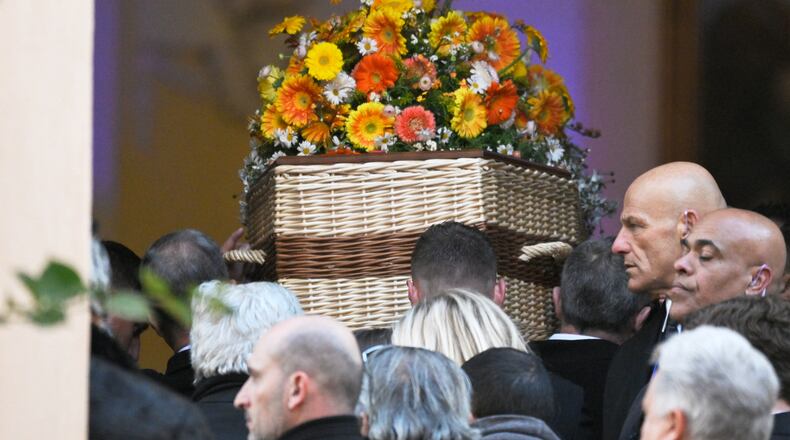 Actor Brigitte Bardot's coffin is carried into Notre-Dame de l'Assomption church for her funeral ceremony, Wednesday, Jan. 7, 2026 in Saint-Tropez, southern France. (AP Photo/Philippe Magoni)