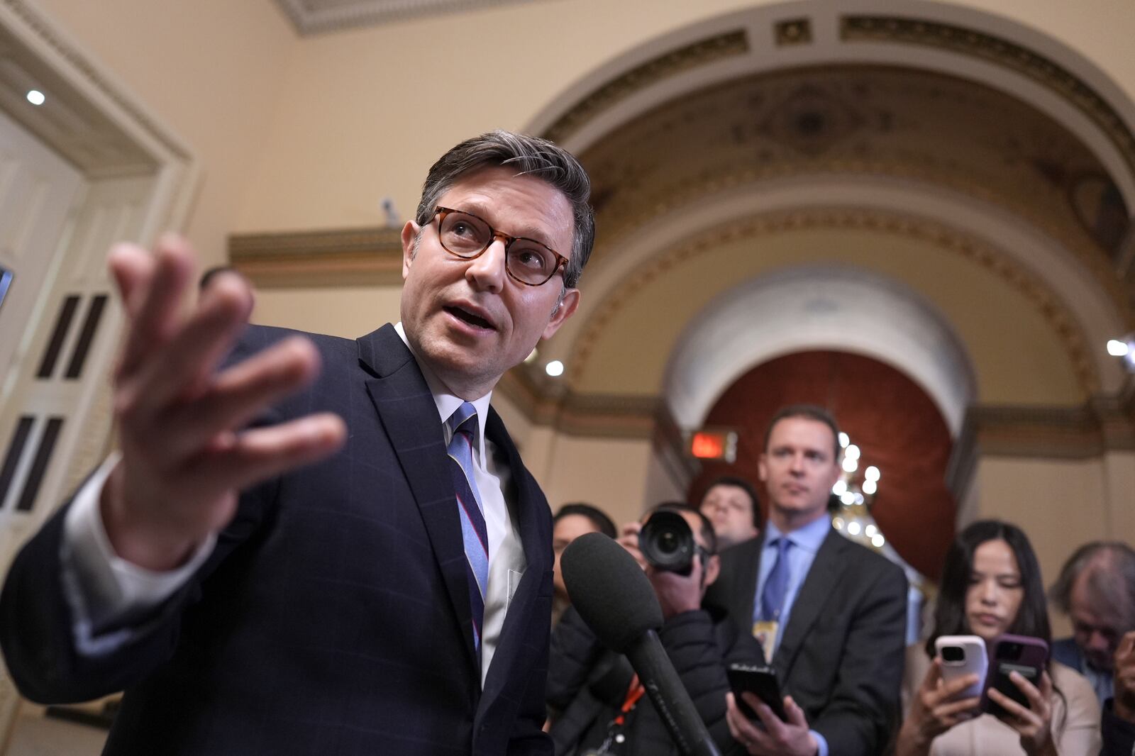 Speaker of the House Mike Johnson, R-La., talks to reporters just after House Republicans narrowly approved their budget framework, at the Capitol in Washington, Thursday, April 10, 2025. (AP Photo/J. Scott Applewhite)
