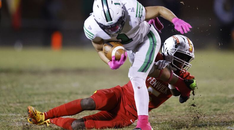Badin's Carter Russo carries the ball defended by Fenwick's Jordan Vann. Badin defeated Fenwick 14-6 in their football game Friday, Oct. 14, 2022 at Bishop Fenwick High School. NICK GRAHAM/STAFF