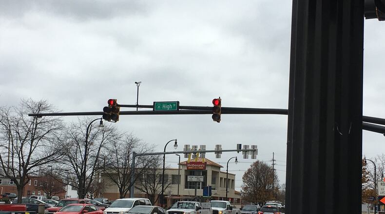 Hamilton officials believe the painting of utility boxes and light poles in the city matte black makes a subtle but significant visual difference in appearance. MIKE RUTLEDGE/STAFF