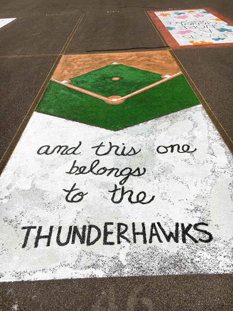 PHOTOS Lakota East seniors paint parking spots