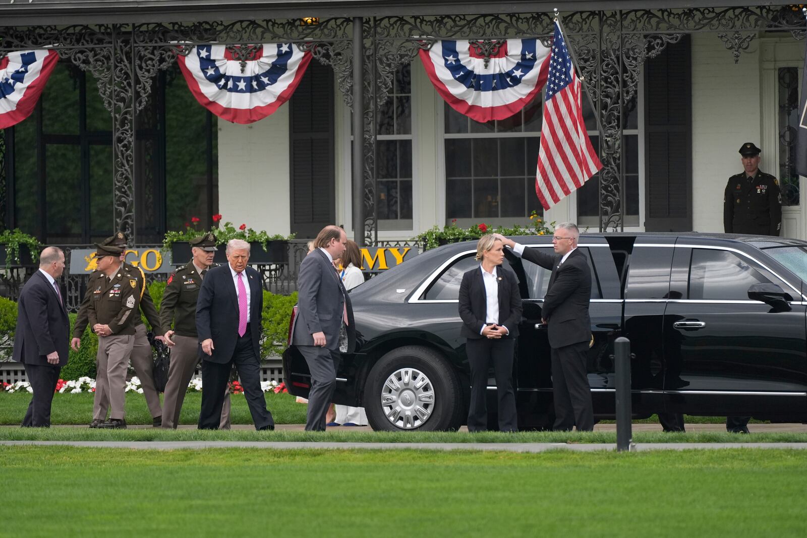 President Donald Trump, fourth from left, walks to board his motorcade before delivering the commencement speech at the United States Military Academy commencement ceremonies in West Point, N.Y., Saturday, May 24, 2025. (AP Photo/Manuel Balce Ceneta)