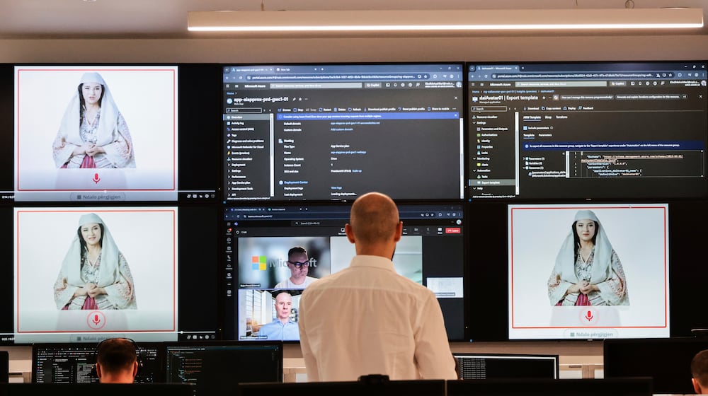 FILE - Albanian experts work at the National Agency for Information Society as an artificial intelligence "minister" Diella, whose name means "Sun" in Albanian, is seen on the screens in Tirana, Albania, Friday, Sept. 12, 2025. (AP Photo/Vlasov Sulaj, File)