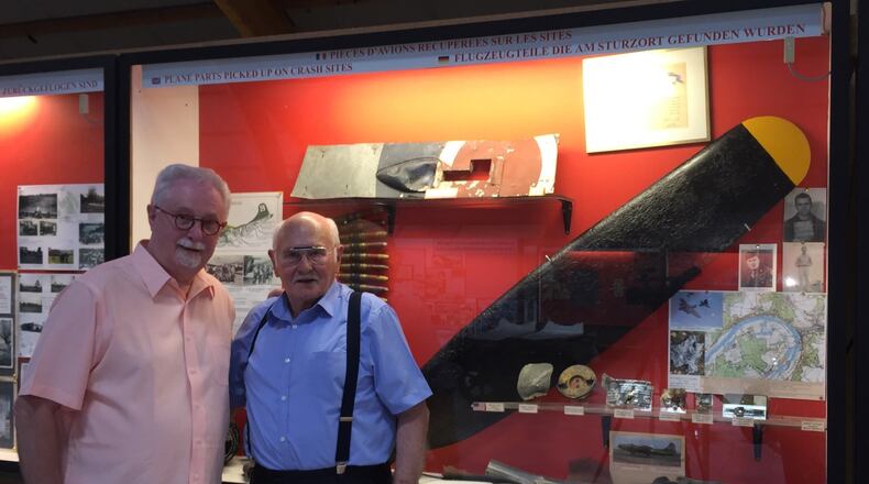 Sam Ashworth, left, a Middletown historian, visited a World War II museum four years ago operated by Jean Erisay. They're pictured in front of the display that includes a propeller off a bomber that was shot down in 1942. The propeller is being shipped from France to Middletown and will be on display in the Middletown Historical Society. SUBMITTED PHOTO.