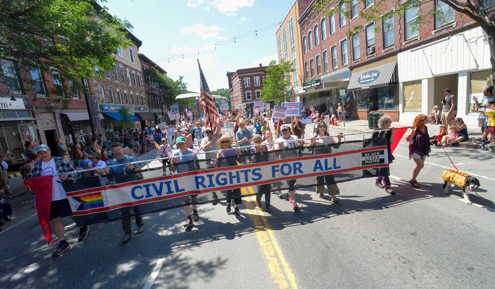 Protesters march against President Donald Trump during the annual Fourth of July parade in Brattleboro, Vt., on Friday, July 4, 2025. (Kristopher Radder/The Brattleboro Reformer via AP)