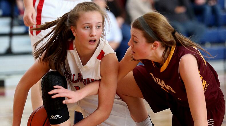 Talawanda guard Addie Brown (left) tries to keep a loose ball away from Karlie Becker of Ross during their game at Talawanda on Feb. 6, 2016. COX MEDIA FILE PHOTO