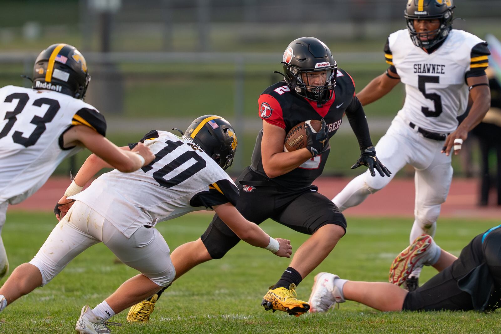 Tecumseh High School's Noah Carl runs past several Shawnee defenders during their game on Friday, Sept. 5 at Spitzer Stadium in New Carlisle. The Arrows beat Shawnee 14-12. RODNEY GETZ/CONTRIBUTED PHOTO