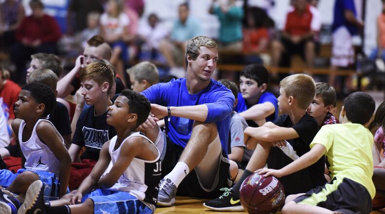 Luke Kennard sits with Air Kev team players during a celebration for the players and parents Friday, June 5, 2015, at Kingdom Sports Center in Franklin. Kennard, basketball trainer Kevin “Air Kev” Duncan, rapper and motivational speaker L.G. Wise and the Kingdom crew spoke to the young basketball players and their families promoting good decisions and work ethics. NICK GRAHAM/STAFF