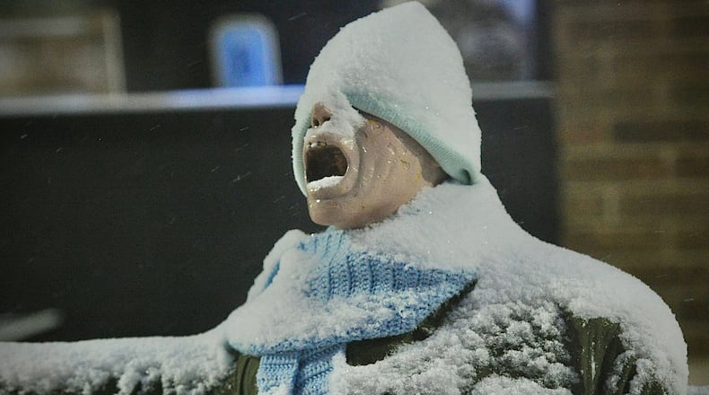 Snow and cold weather Friday morning Jan. 11, 2025 has even the mannequin in front of Foy's Halloween and Variety Store in Fairborn screaming. MARSHALL GORBY\STAFF