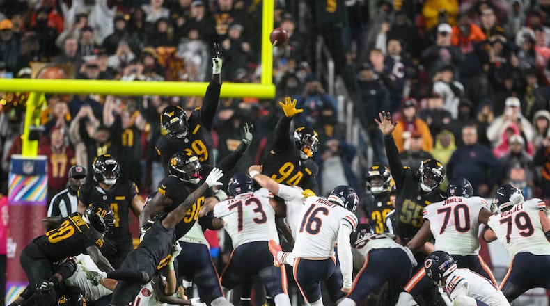 Chicago Bears kicker Jake Moody (16) kicks the game-winning field goal as time expires in an NFL football game against the Washington Commanders, Monday, Oct. 13, 2025, in Landover, Md. (AP Photo/Nick Wass)