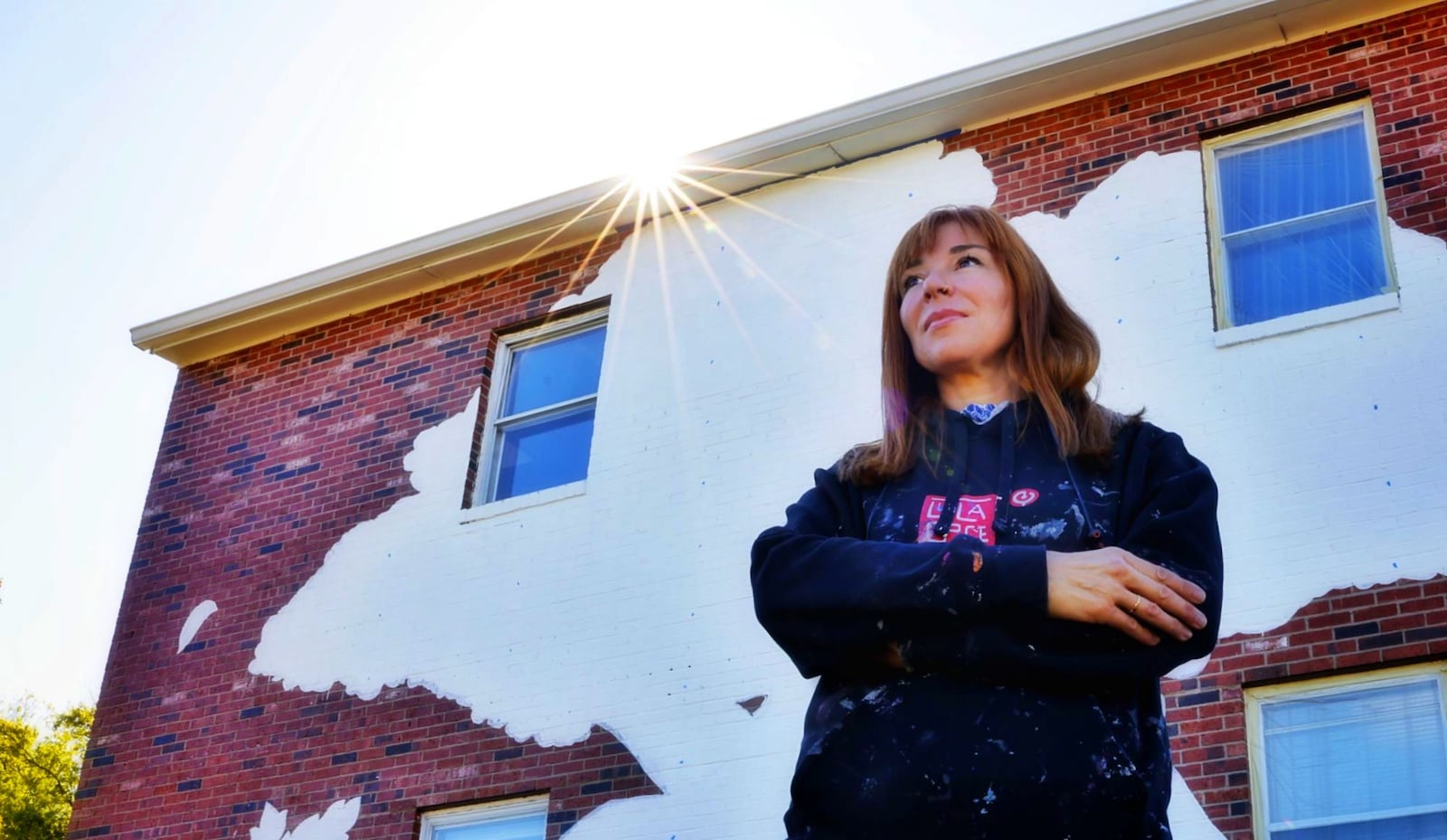 Spanish artist Lula Goce is in town painting Springboro's first public mural on the side of a building at 15 S. Main Street. Goce has traveled all over the world creating large wall murals. NICK GRAHAM/STAFF