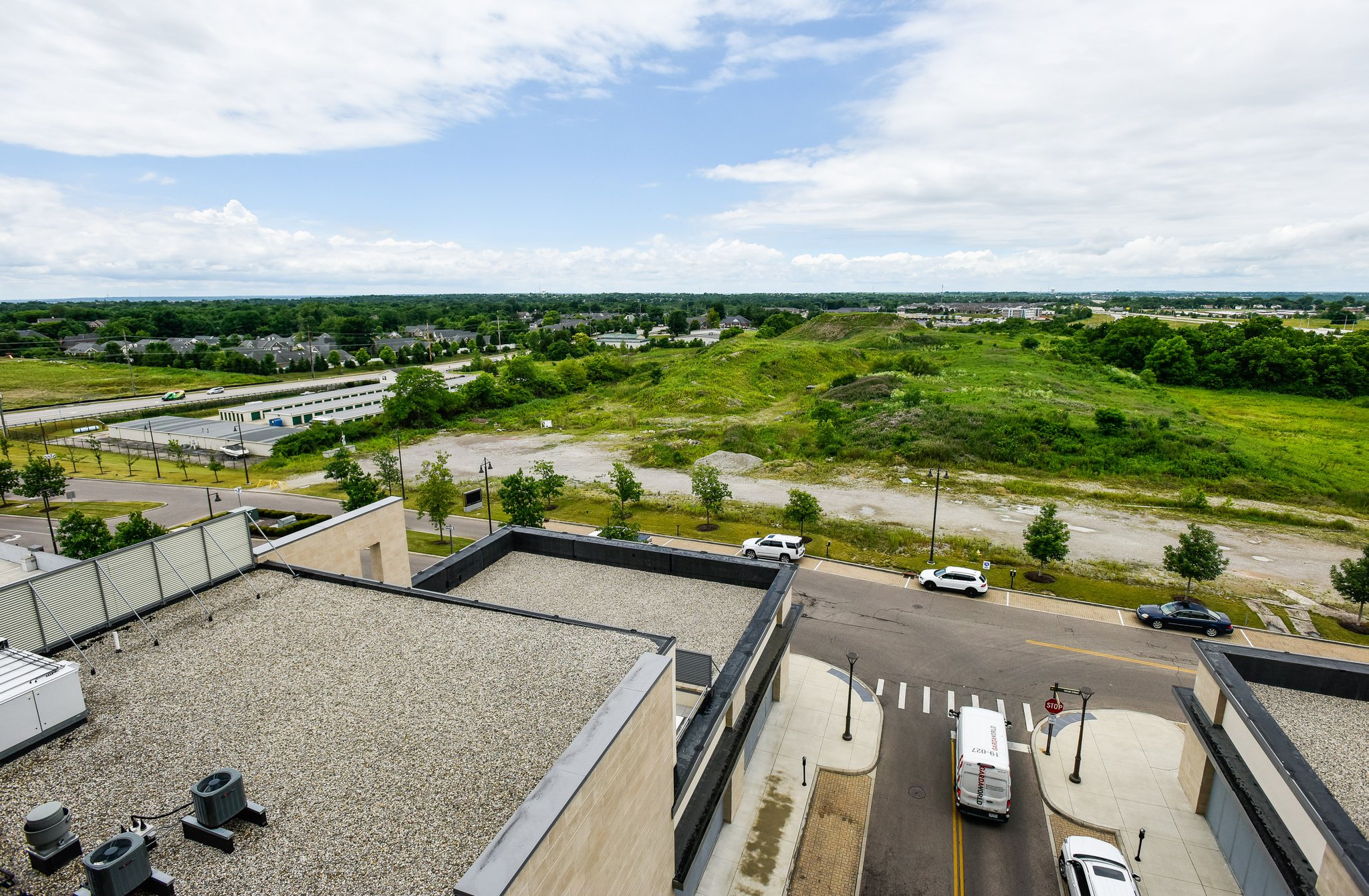 Liberty Center developer Steiner & Associates has announced that COSTO will construct 356-unit development Liberty Flats on 22 acres west of Taylor Street and adjacent to Liberty Center. This is a view looking at the land from AC Hotel by Marriott Cincinnati at Liberty Center. NICK GRAHAM / STAFF