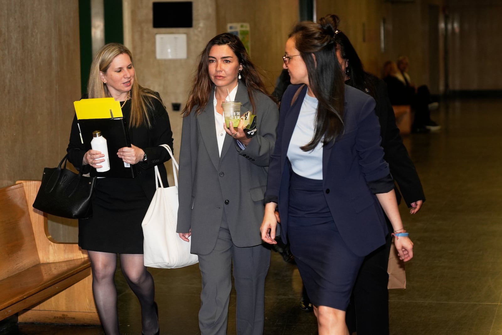 Miriam Haley, center, an accuser testifying at Harvey Weinstein's rape trial, arrives to the courtroom after a break in New York, Tuesday, April 29, 2025. (AP Photo/Seth Wenig)