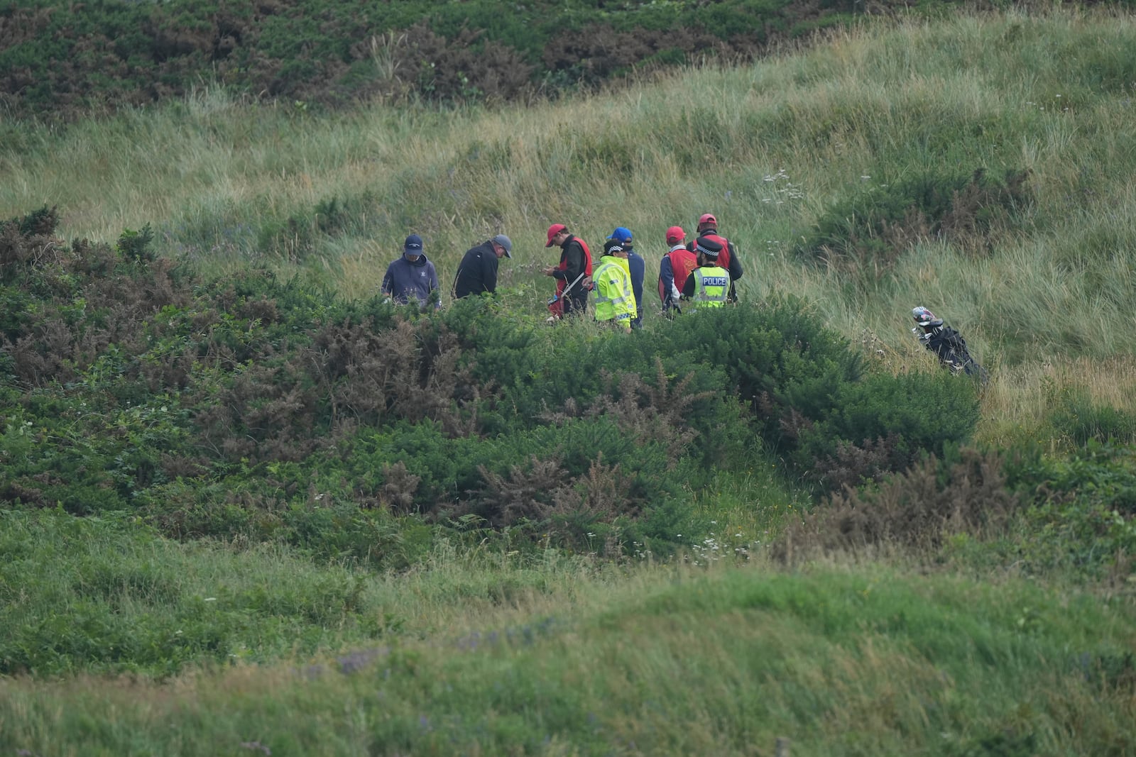 Police guard the Trump Turnberry golf course, as golf continue to play in Turnberry, Scotland, Friday, July 25, 2025, ahead of President Trump's visit Scotland. (AP Photo/Alastair Grant)