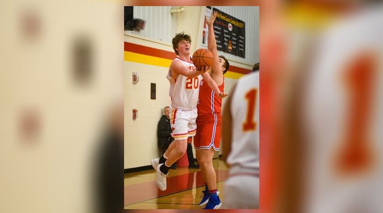 Fenwick’s A.J. Braun (20) makes a move toward the basket during a game against Clinton-Massie last season. ROB MCCULLEY/RAM PHOTOGRAPHY