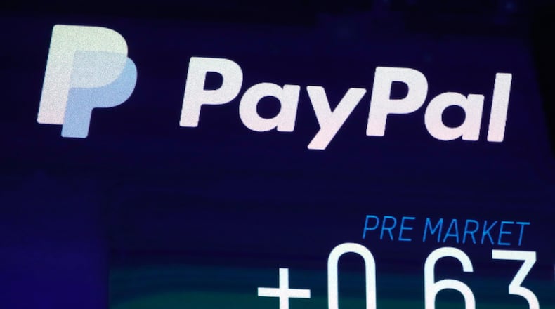 FILE - ,The PayPal logo appears on a screen at the Nasdaq MarketSite, on Oct. 3, 2018 in New York. PayPal reports earning on Tuesday, July 30, 2024. (AP Photo/Richard Drew, File)