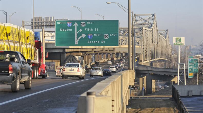 Two lanes of Interstate 71/75 in each direction over the Brent Spence Bridge could close as early as Friday for approximately two months. Bridge deck repair and structural maintenance will close lanes and impact ramps and traffic flow, according to Kentucky Transportation Cabinet officials. MICHAEL D. PITMAN / 2015