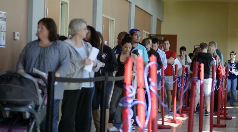 More than 7.86 million Ohioans were registered to vote in the 2016 presidential election this past November. Ohio Secretary of State Jon Husted believes we could see a significant increase in that number by the 2020 election. Pictured are voters waiting in line to cast an early ballot on Sunday, Nov. 6, 2016, just one day before early voting ended for the 2016 presidential election.