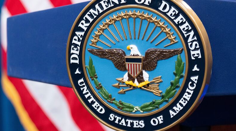 FILE - The Department of Defense seal is seen on the podium in the Press Briefing room at the Pentagon on Oct. 29, 2024, in Washington. (AP Photo/Kevin Wolf, File)