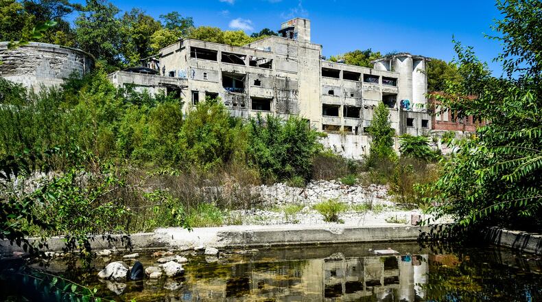 The transformation continues Wednesday, August 28, 2019 to turn the former Champion Paper/ Smart Papers mill into Spooky Nook at Champion Mill. Demolition and restoration crews are making progress on the sports and convention center facility that is scheduled to open in 2021. The developer creating the gigantic indoor sports facility and convention center has mentioned using the large structure at the back of the lot for as living spaces with sweeping riverfront views. NICK GRAHAM/STAFF