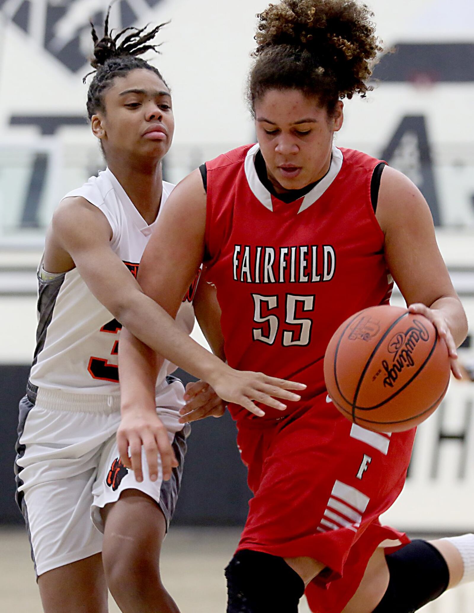 Fairfield forward Maddie Schaeffer dribbles by Withrow forward Ashley Brunner during a Division I sectional game Saturday afternoon at Lakota East. CONTRIBUTED PHOTO BY E.L. HUBBARD