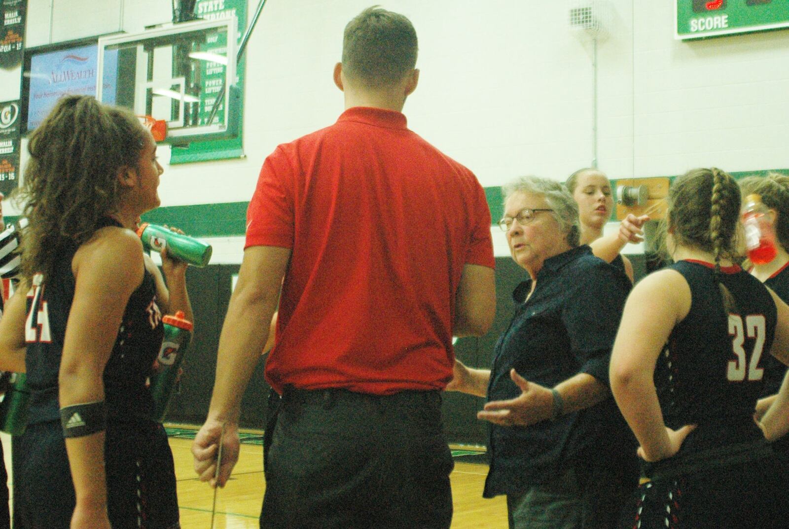 Talawanda coach Mary Jo Huismann talks to her team during a timeout Wednesday night at Mulcahey Gym in Hamilton. The Brave lost to Badin 79-36. RICK CASSANO/STAFF