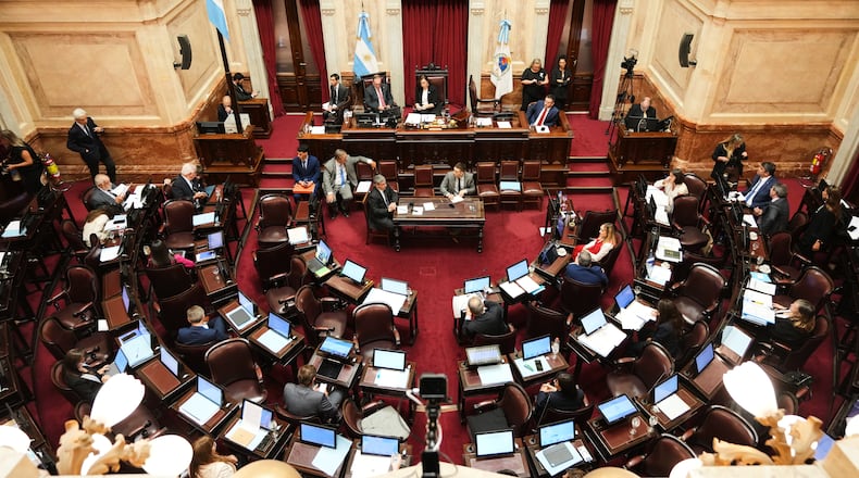 Senators debate a bill that would lower the age of criminal responsibility from 16 to 14, before discussing a labor reform bill proposed by President Javier Milei's government, at Congress in Buenos Aires, Argentina, Friday, Feb. 27, 2026. (AP Photo/Natacha Pisarenko)