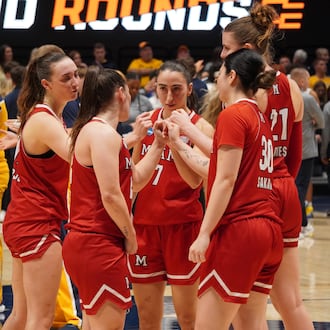 Miami University women's basketball players break a huddle during their NCAA Tournament game against West Virginia on Saturday, March 21, 2026, at Hope Coliseum in Morgantown, W.Va. CHRIS VOGT / CONTRIBUTED