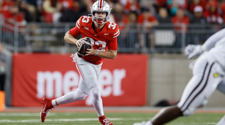 Ohio State quarterback Devin Brown looks for an open pass against Western Michigan during the second half of an NCAA college football game Saturday, Sept. 7, 2024, in Columbus, Ohio. (AP Photo/Jay LaPrete)